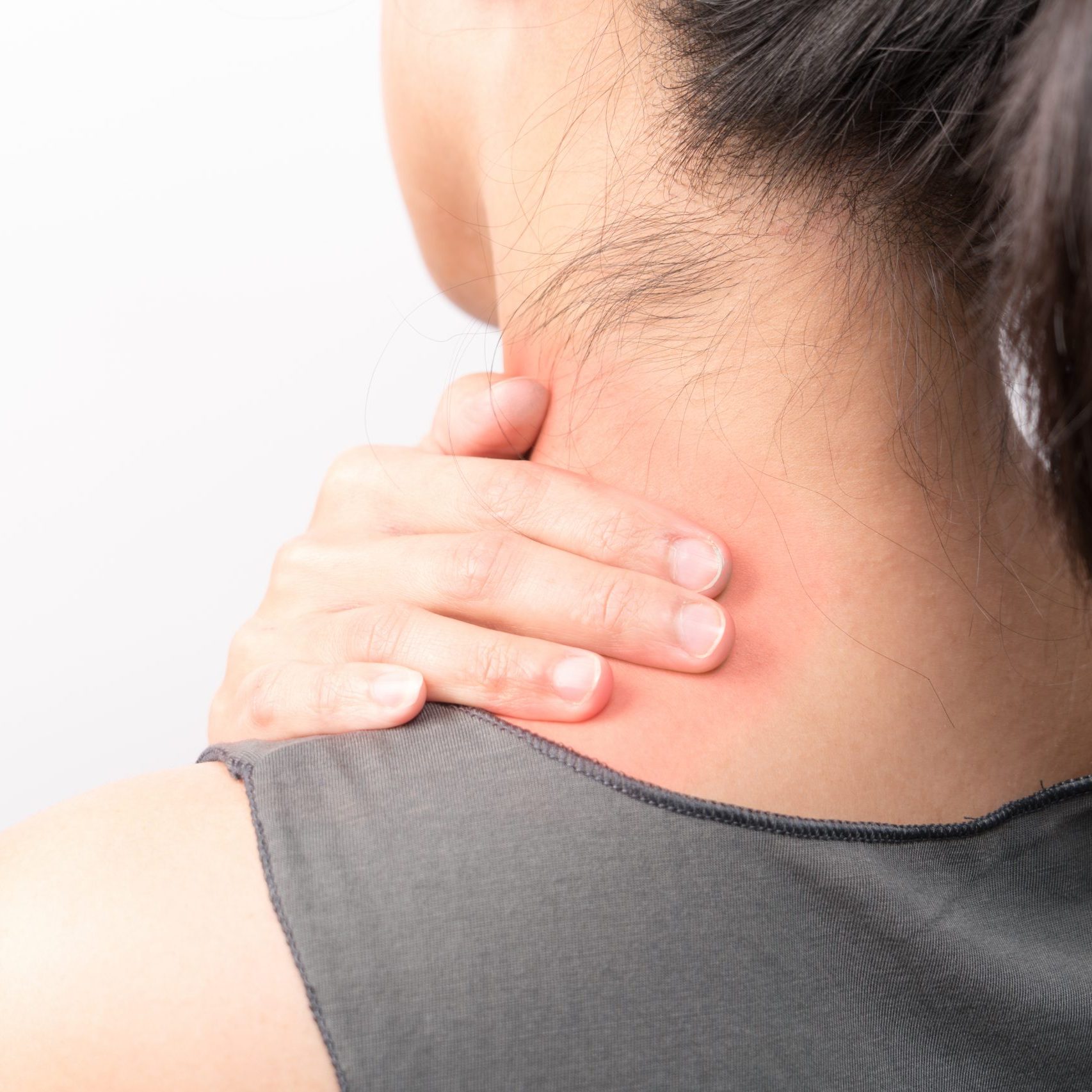 closeup women neck and shoulder pain/injury with red highlights on pain area with white backgrounds, healthcare and medical concept