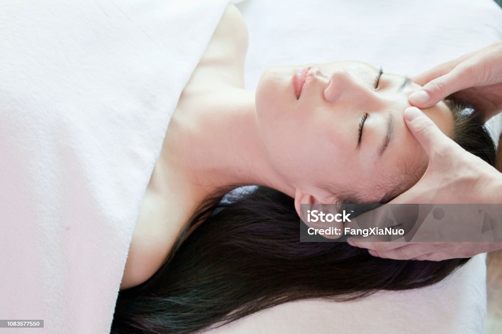 Chinese woman having massage in spa